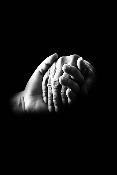 Hands held in support